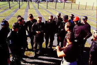 A group of men standing around each other.