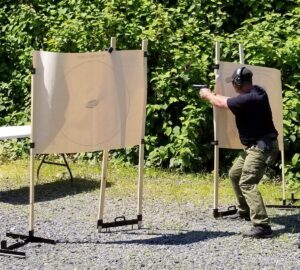 A man is aiming at an object in the air.